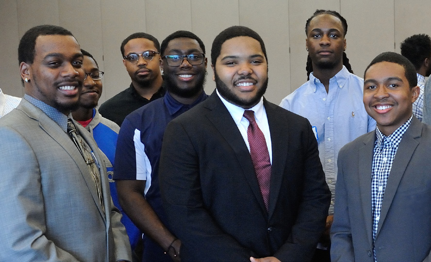 attendees of the Black Male Summit pose for a photo